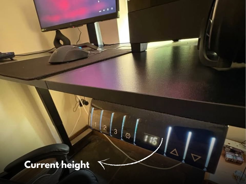 Height-adjustable electric gaming desk with a panel that displays the current height
